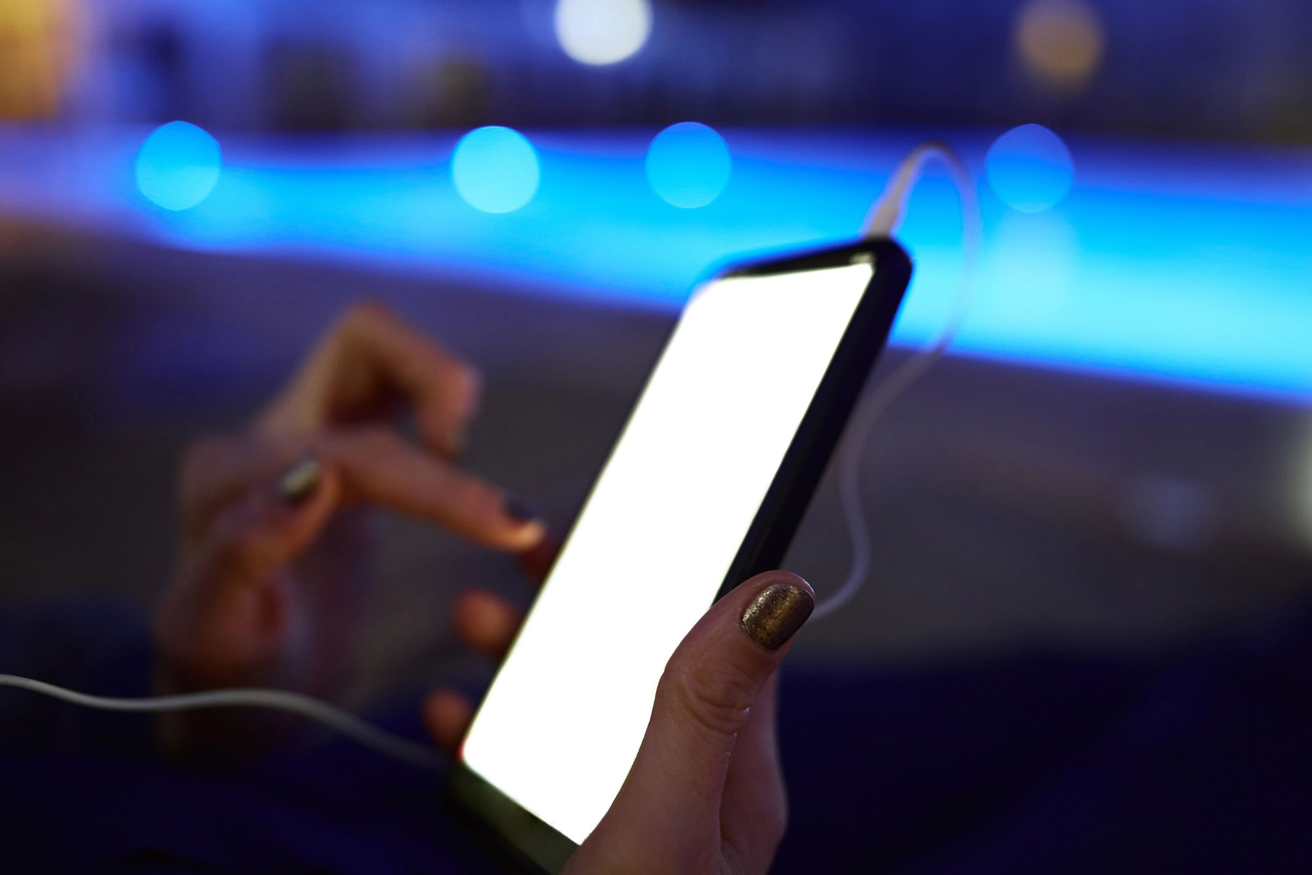 Browsing event details on a smartphone at night